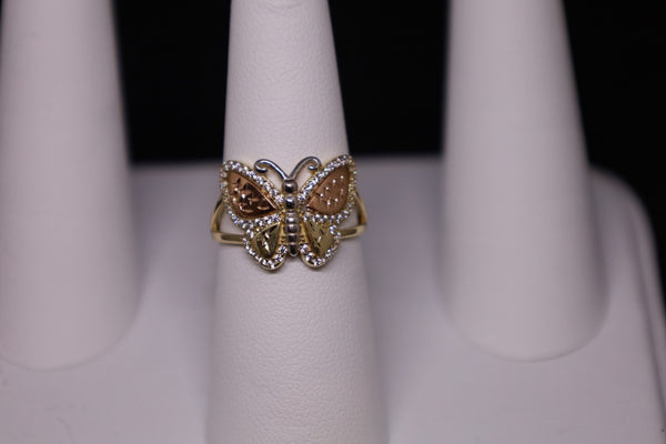 Anillo de mariposa con circonita cúbica en tres tonos de oro de 14 kt